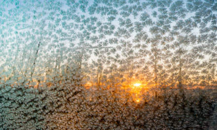 Sunrise mirrored in the car window