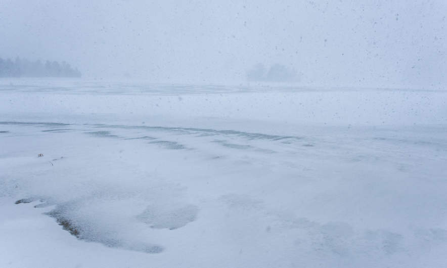 Heavy snowfall over the lake Snesviken