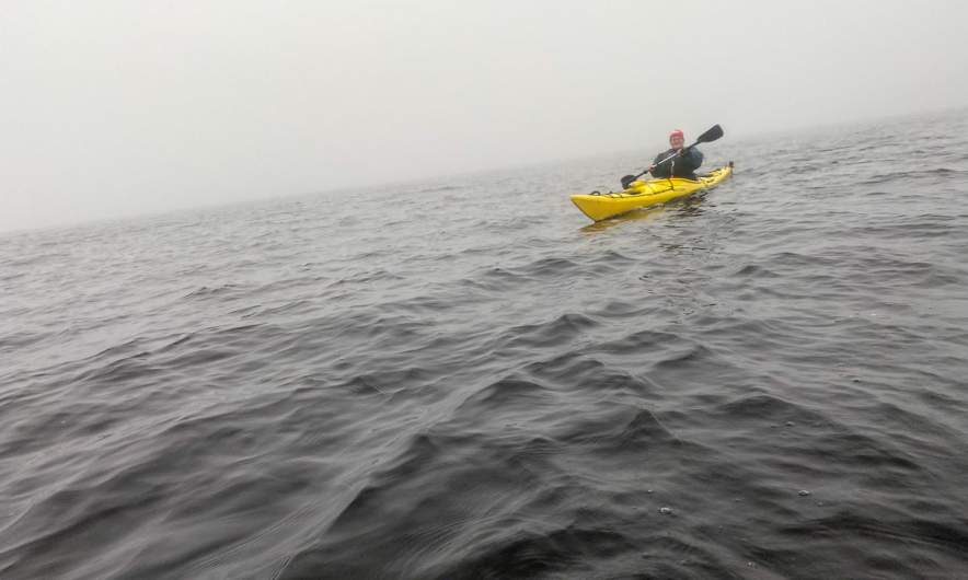 Annika paddling through the fog