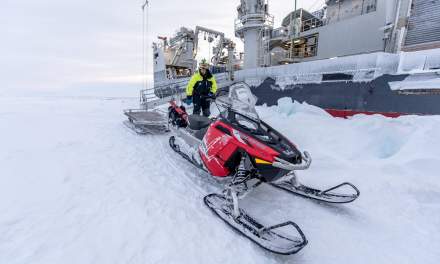 The snowmobile is used to transport people and equipment