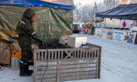A market stallholder warming up