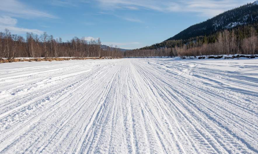 A zillion snowmobile tracks on the river
