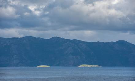 Sunny islands dark mountains