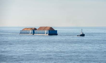 Barge, towed by a tugboat